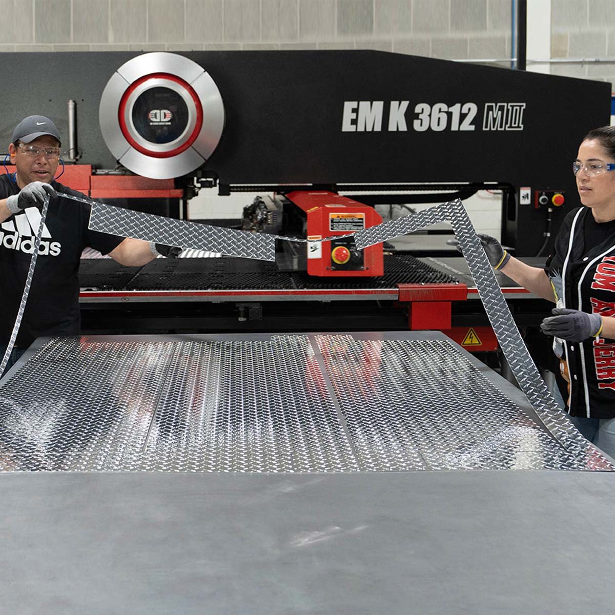 FABMAX operators running material through the turret punch